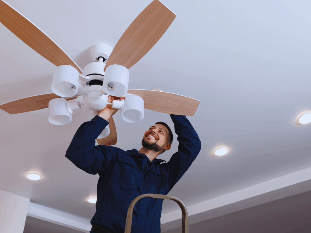 Electrician fixing slow ceiling fan