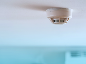 Smoke detector on living room ceiling of Pompano Beach home